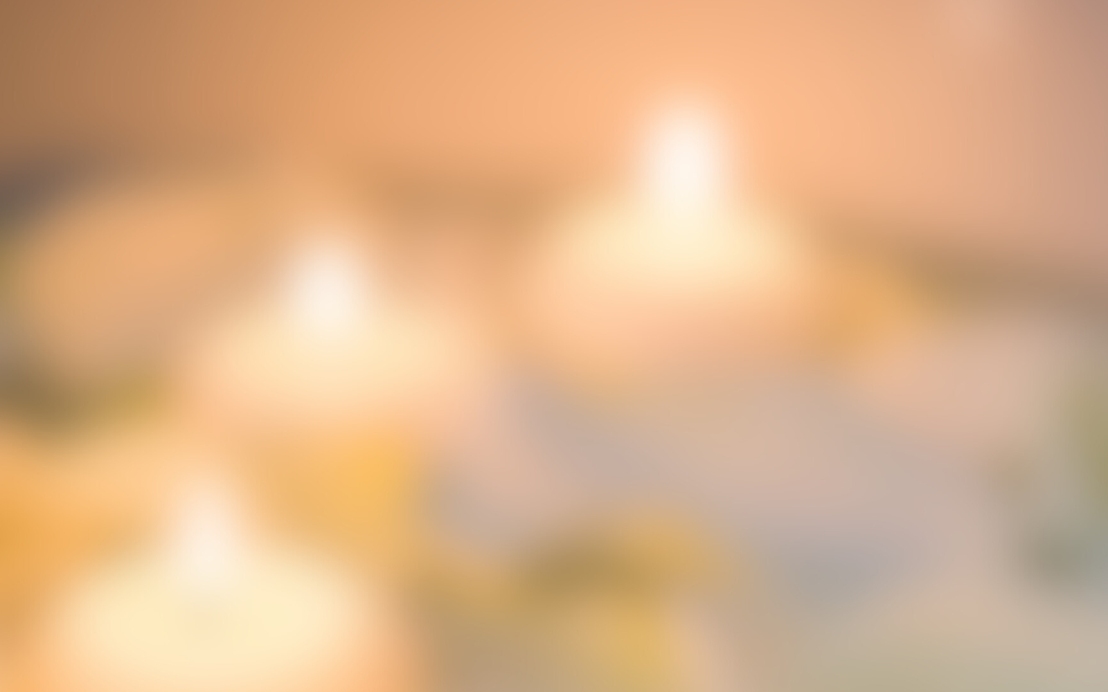 Blurred image of Luxe Wicks soy hand-poured candles